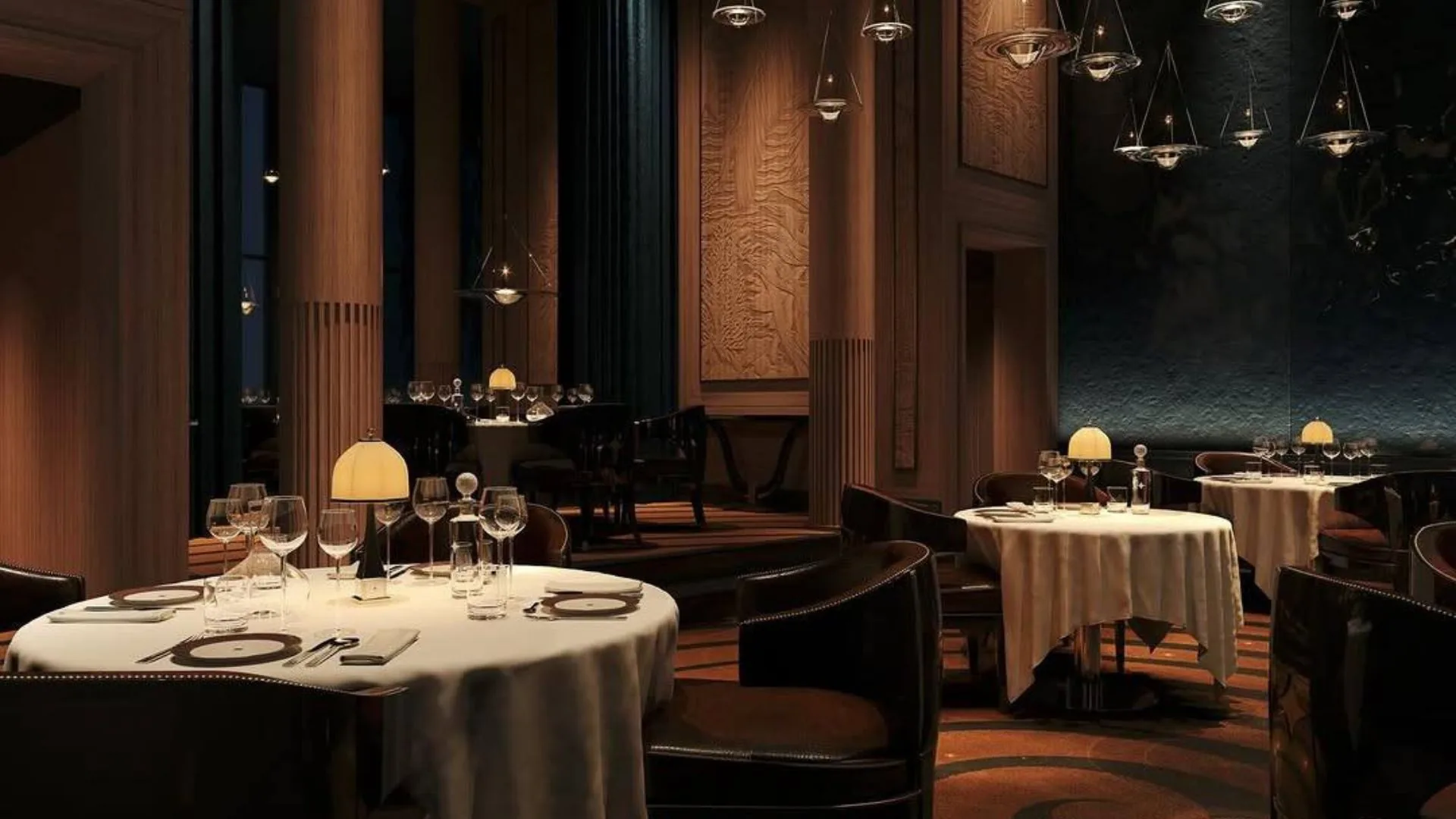 Intimate restaurant with round tables and warm lighting.