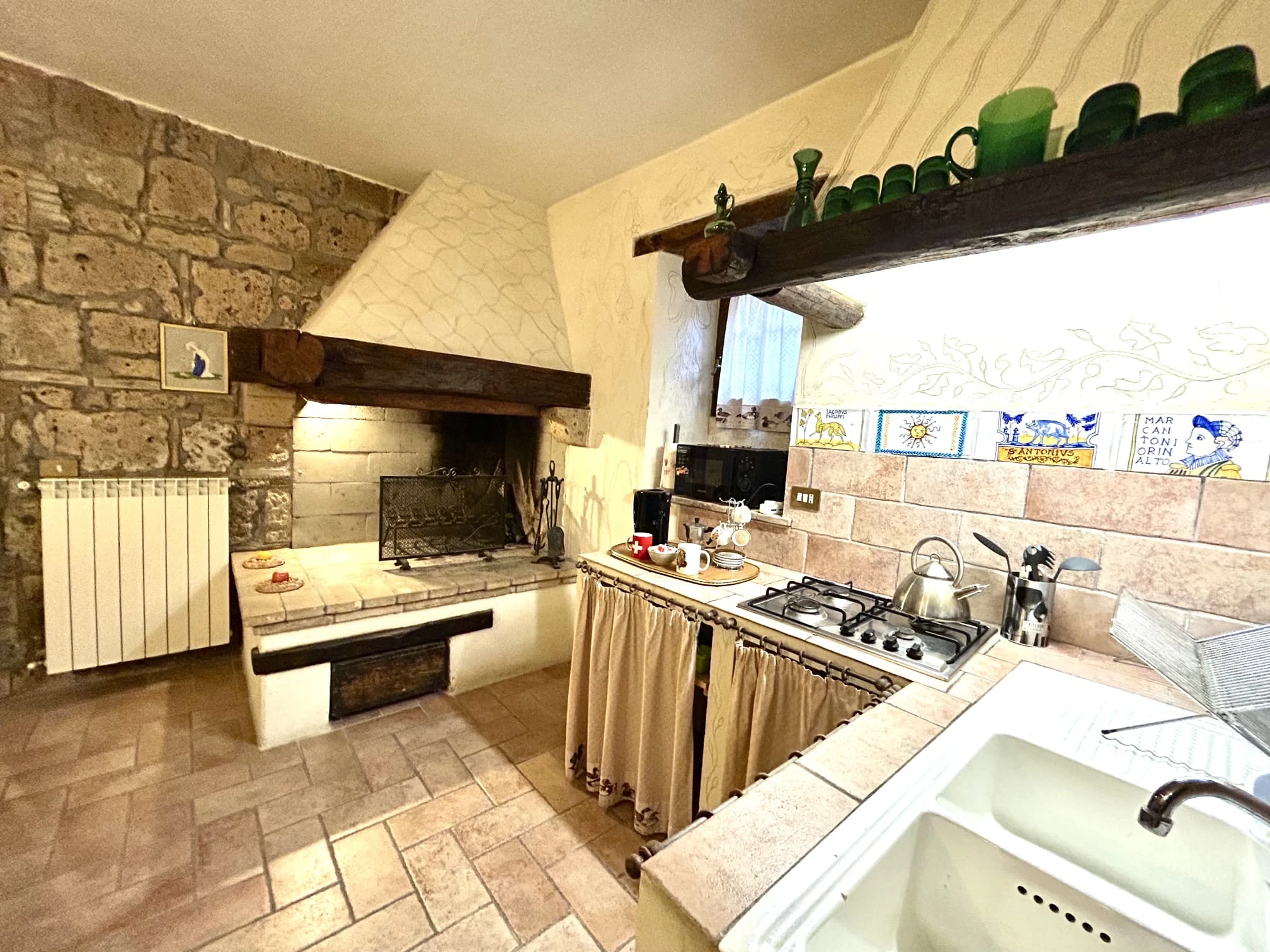 Innominato kitchenette and fireplace